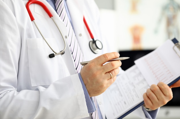 Male medicine doctor hand holding silver pen