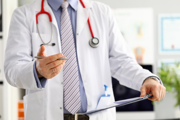 Male medicine doctor hand holding silver pen