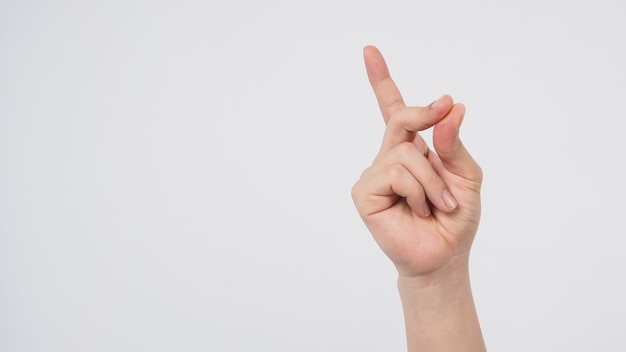 Male model is doing snap gesture hand sign on white background.