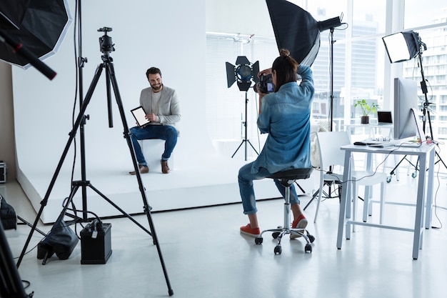 Male model posing for photographer