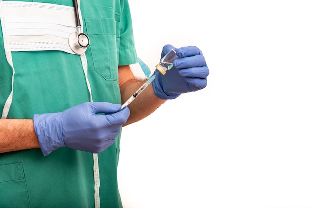 Male nurse carrying vaccine or medication in syringe