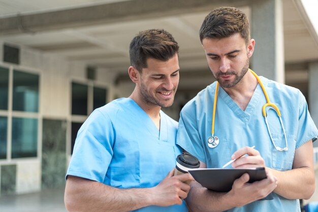 Male nurse with stethoscope  and coffee