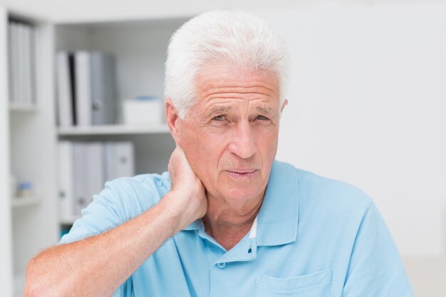 Male patient suffering from neck ache