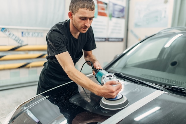 Male person prepares to restore the paint of car