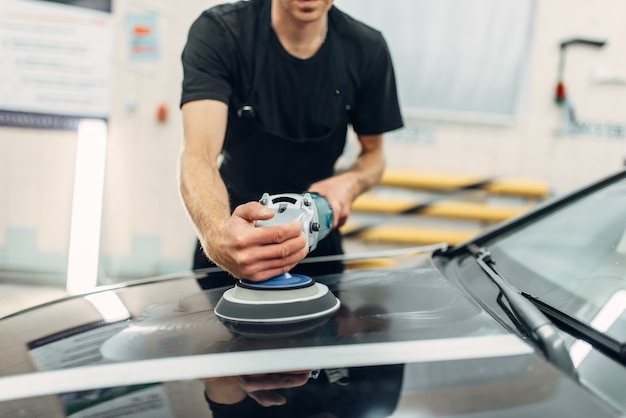 Male person prepares to restore the paint of car