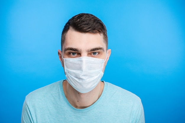 Male posing with surgical mask on face 