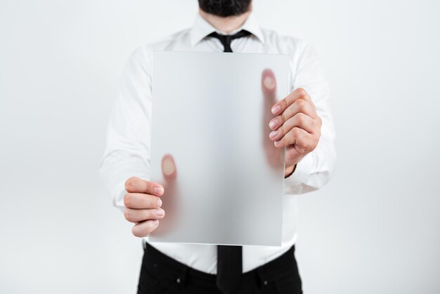 Male Professional Holding Blank Placard And Showing Important Data Businessman With Paper In Hands Presenting Marketing Strategies For Development Of Business