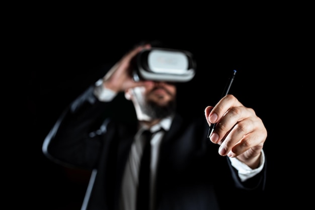 Male professional wearing virtual reality goggles holding pen and presenting modern technology of