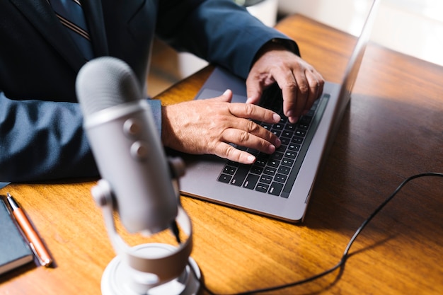 Male radio host broadcasting live in a studio