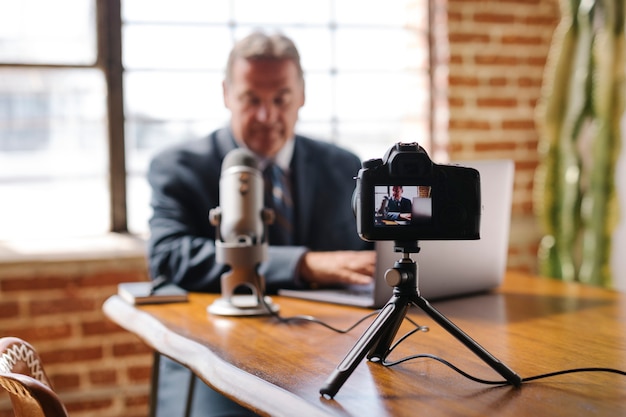 Male radio host talking on the phone