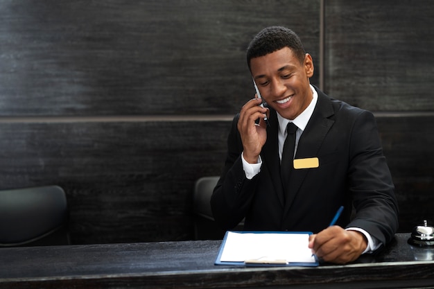 Male receptionist in elegant suit during work hours