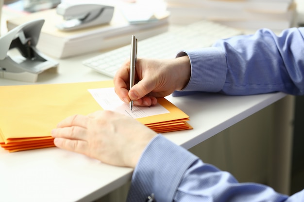 Male secretary working at desks in office