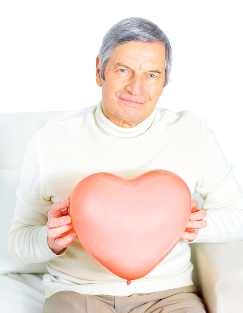 Male senior red heart isolated on white background.