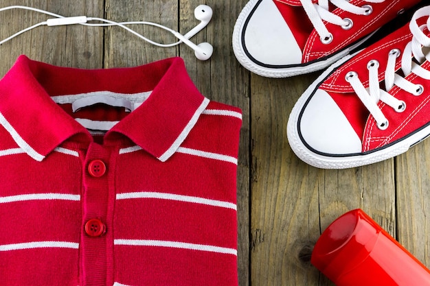 Male set of bright pullover, shoes and headphones