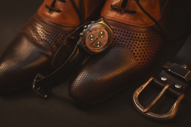 Male shoes and watch and belt