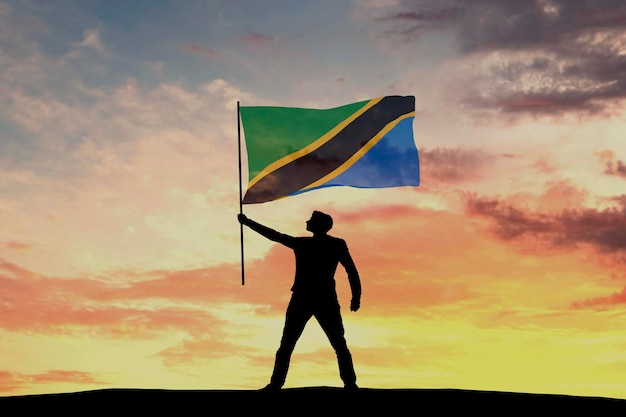 Male silhouette figure waving Tanzania flag 3D Rendering