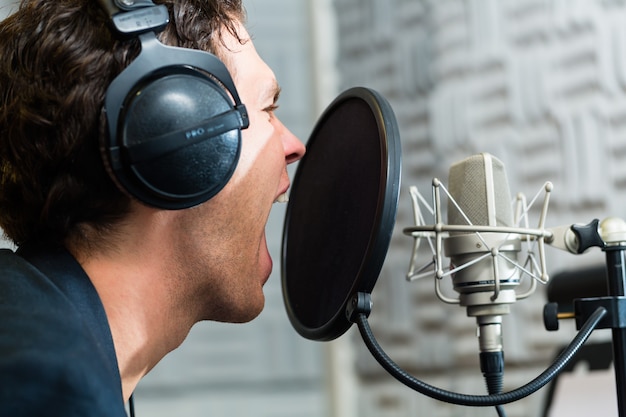 Photo male singer or musician for recording in studio