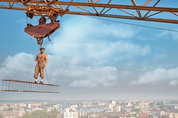 Male standing on construction on high