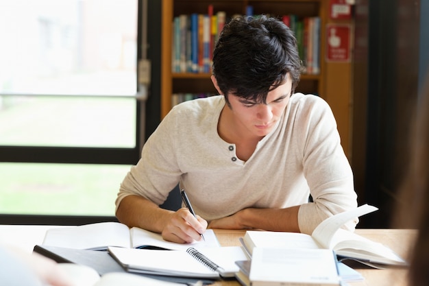 Male student working on an essay