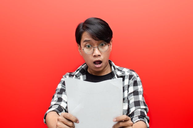 male students or worker with glasses feels glad while holding blank paper work.