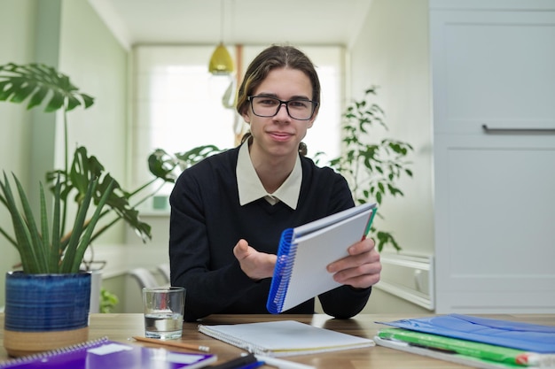 Male teenager talking looking at camera using video communication