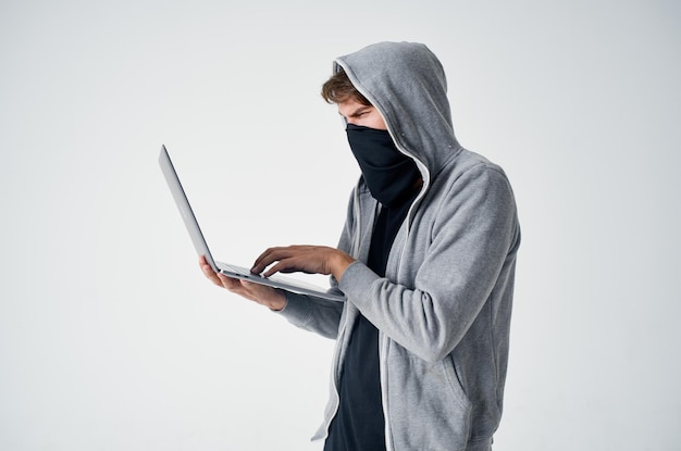 Photo male thief hooded head hacking technology security isolated background high quality photo