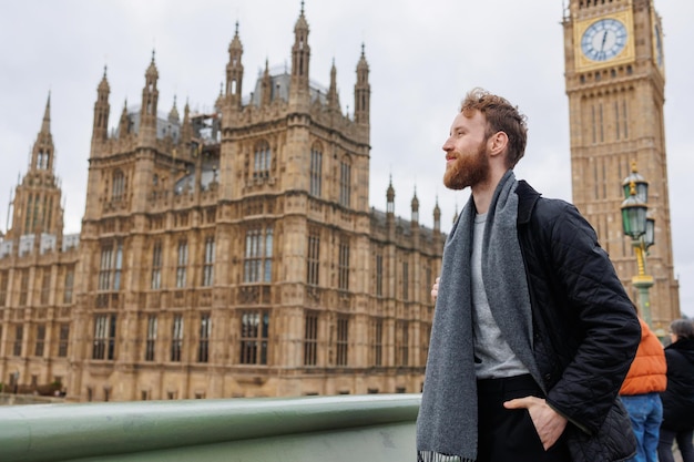 Male tourist in front of Big Ben in London