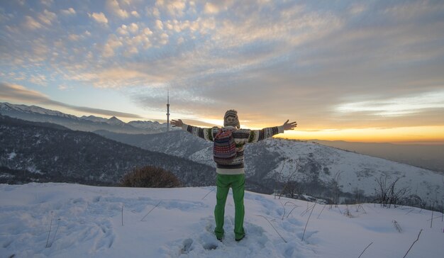 male tourist in the mountains in winter