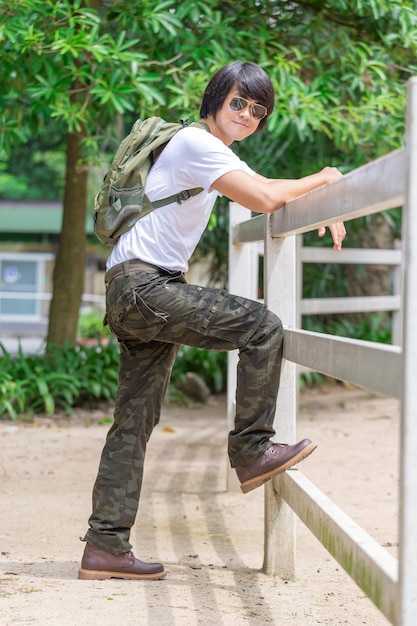 Male tourist in the park. Tourism and travel concept, cargo pants