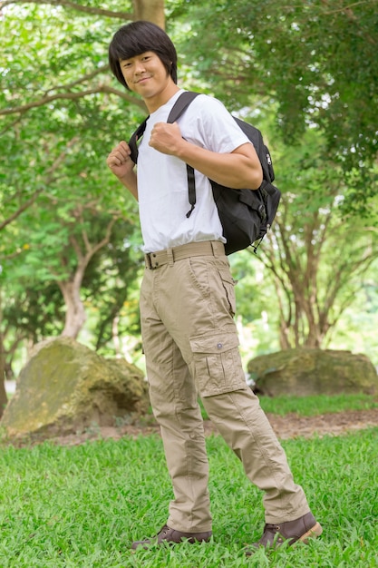 Male tourist in the park. Tourism and travel concept, cargo pants