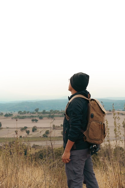 A male tourist on top of mountain