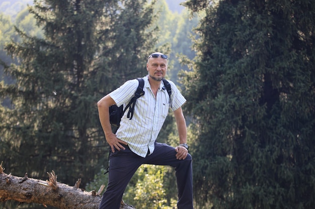 male traveler in spruce forest