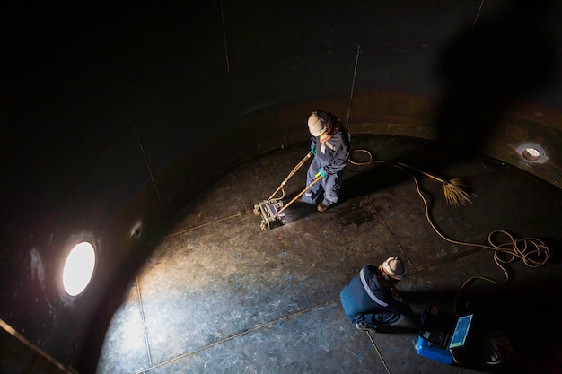 Premium Photo | Male two worker inspection scan tank of rust thickness ...