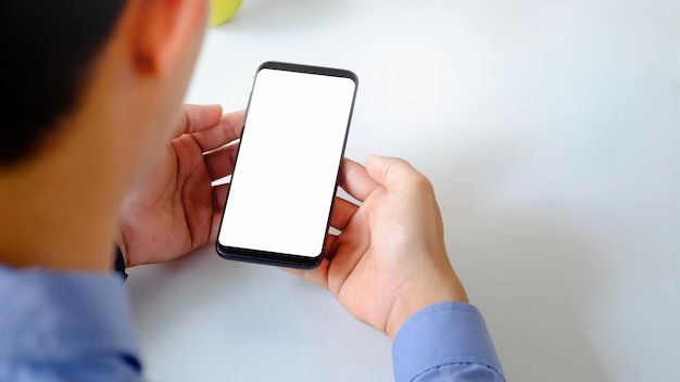 Male using smartphone mockup with empty screen.