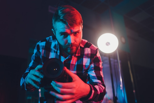 Male videographer with gimball video slr, portrait.