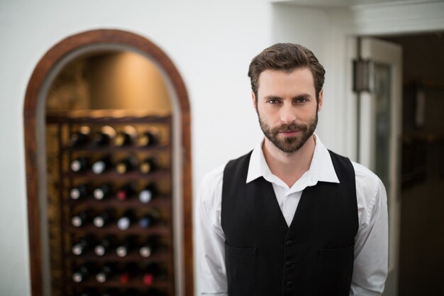 Male waiter standing in the restaurant