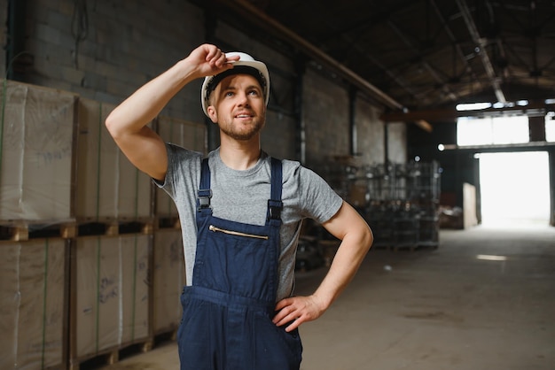 Male warehouse worker portrait in warehouse storage