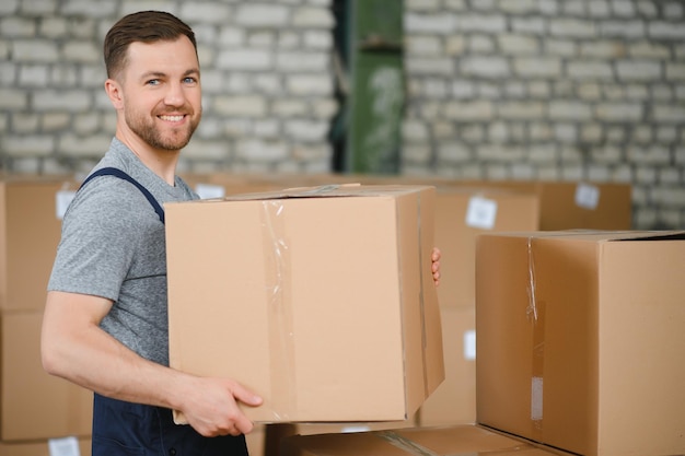 Male warehouse worker portrait in warehouse storage