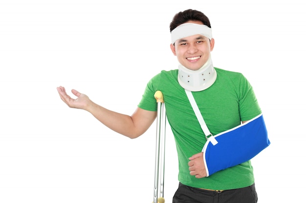 Male with broken arm and crutch presenting