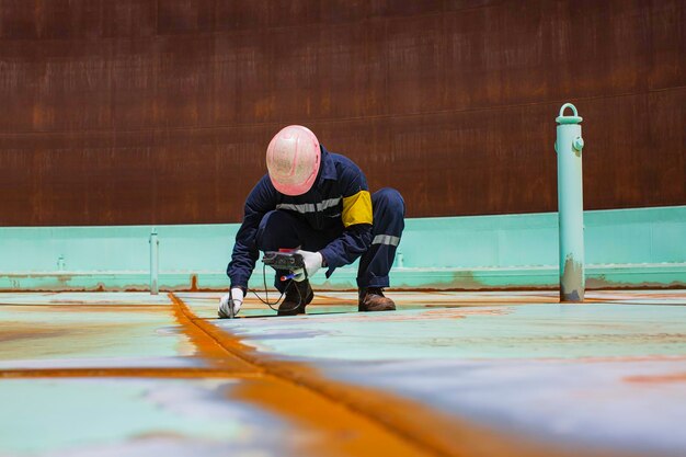 Male worker are for inspection ultrasonic thickness roof plate top