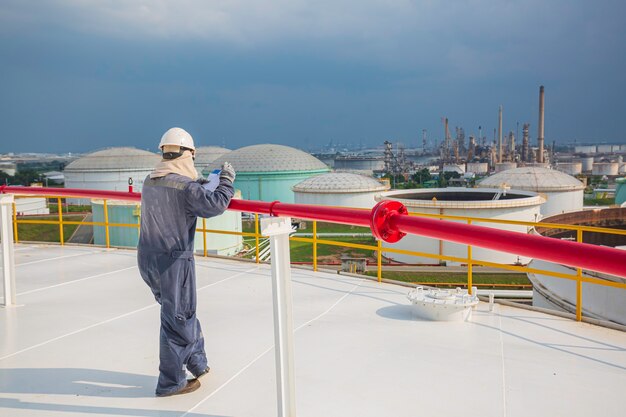 Male worker file record visual inspection tank top the roof dome tank