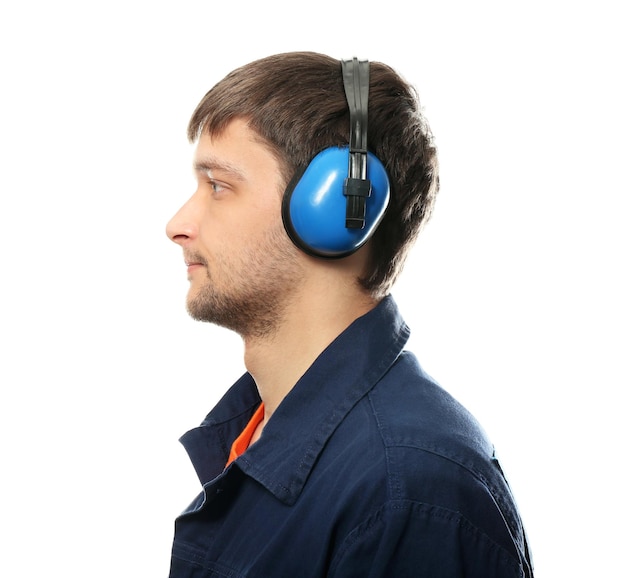 Male worker with headphones on white background Hearing protection equipment