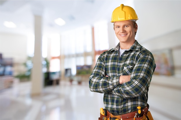 Male worker with tool belt isolated on   background