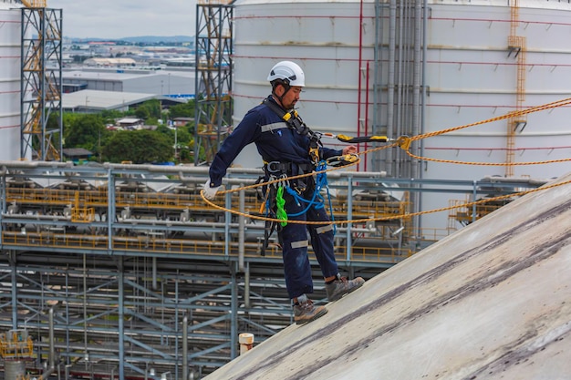 Male workers clear rope access wearing safety first harness\
rope safety line