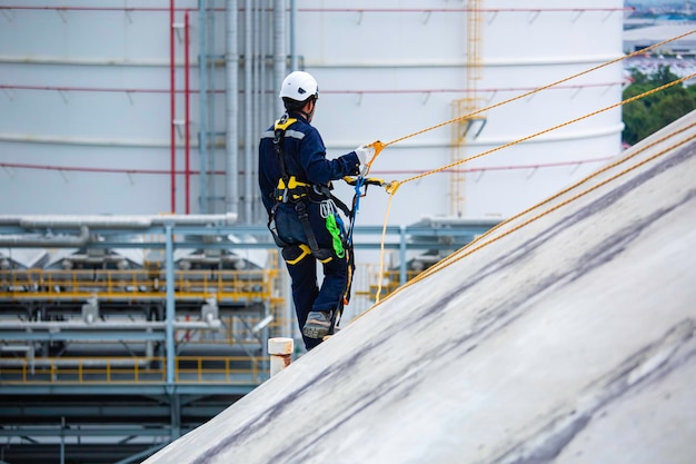 Male workers clear rope access wearing safety first harness\
rope safety line