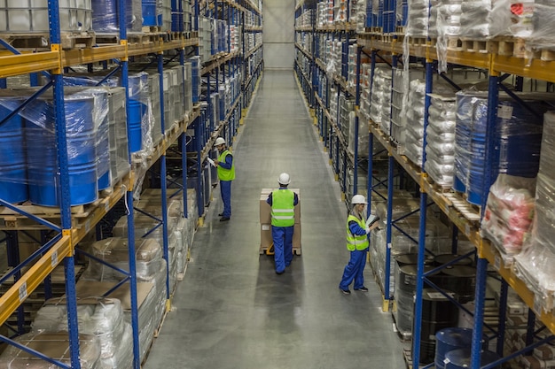 Male workers doing their business in warehouse