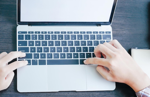 Male working with Laptop computer on the table