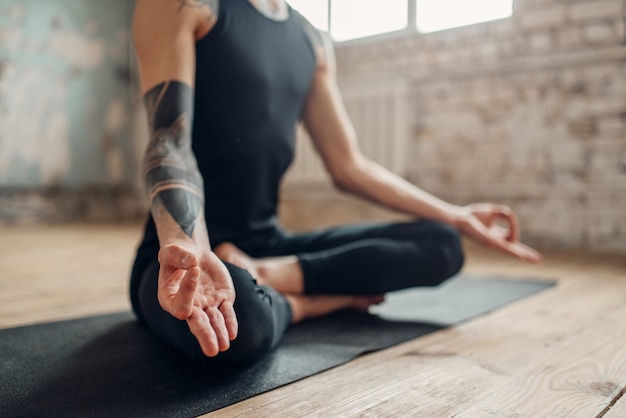 Male yoga, meditation in asana position