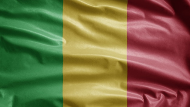 Malinese vlag zwaaien op de wind. close up van mali banner waait gladde zijde