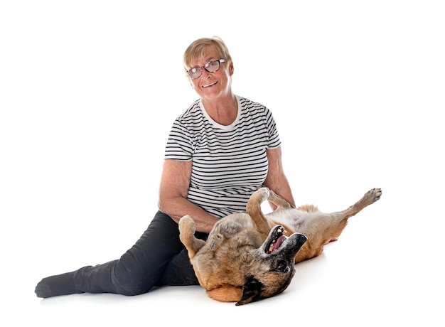 Malinois and woman in studio